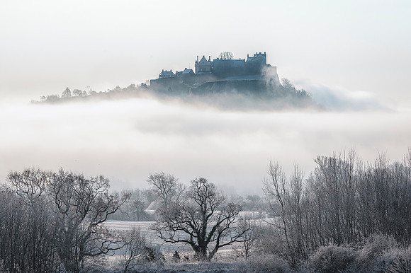 Stirling Castle in Scotland amidst a sea of mist