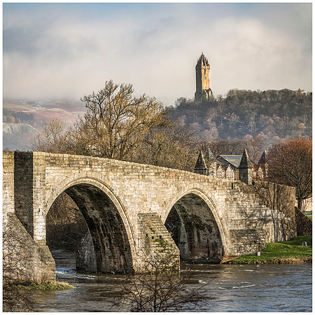 The Wallace Monument and the Old Bridge, in Stirling, Scotland.